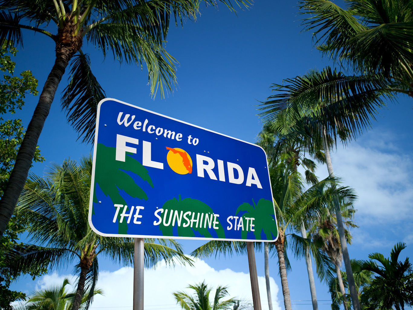 Sign on a highway welcoming people to Florida